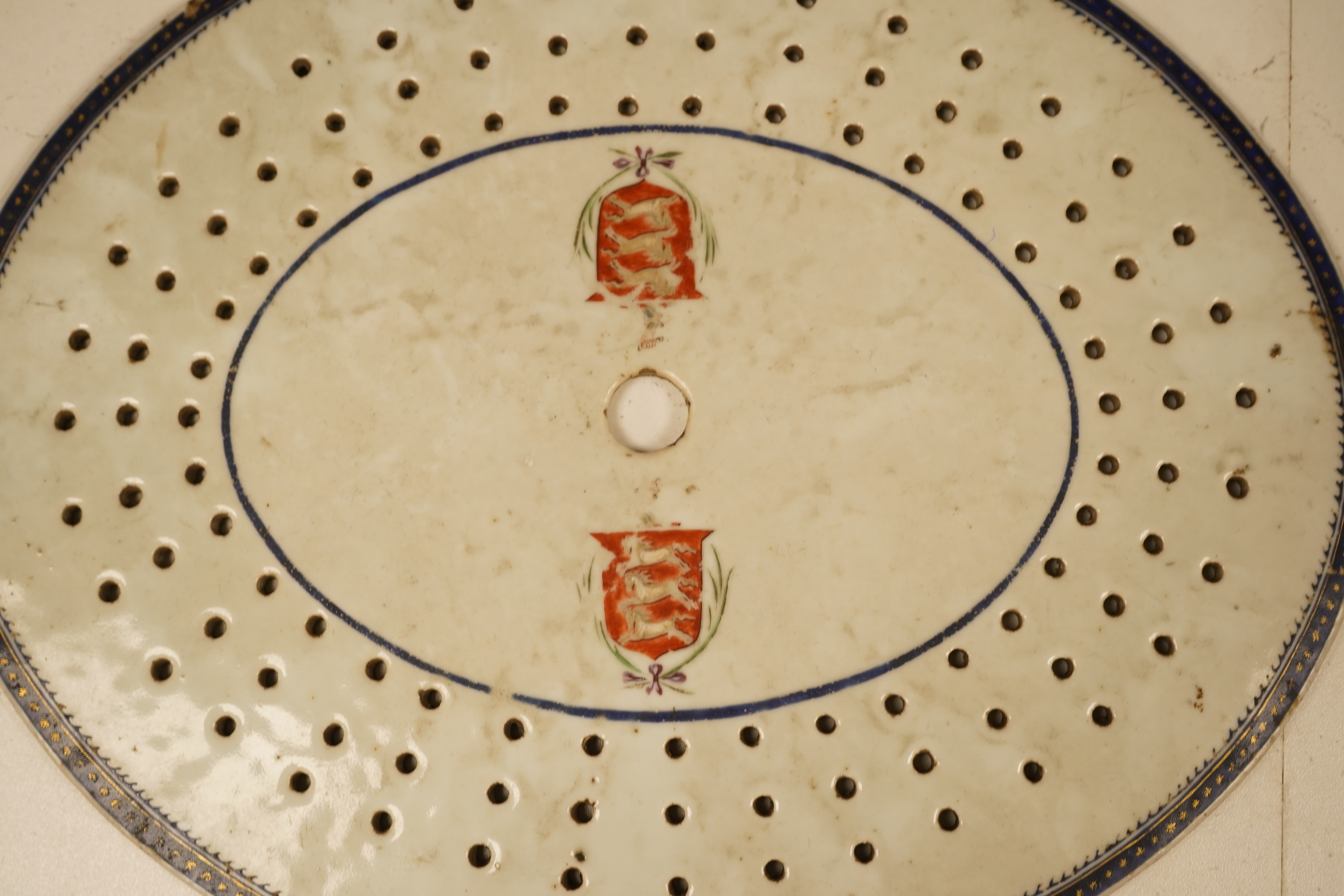 An 18th century Chinese armorial drainer, 18th century, 35cm wide